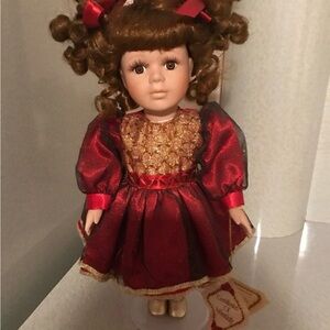 Charming Red and Gold Doll with Curly Hair